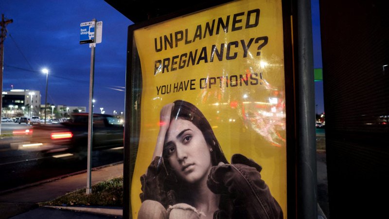 A billboard at a bus stop in Oklahoma City advertises adoption services for pregnant women Dec. 7, 2021. (CNS photo/Evelyn Hockstein, Reuters)