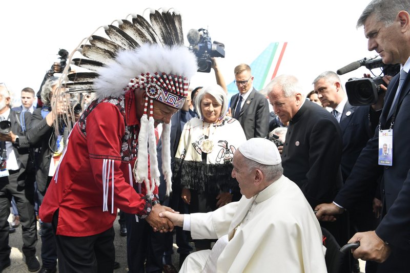 Pope Francis greets Grand Chief George Arcand of the Confederacy of Treaty Six First Nations as he arrives at Edmonton International Airport July 24, 2022. Looking on is Mary Simon, governor general of Canada. The pope was beginning a six-day visit to Canada. (CNS photo/Vatican Media)