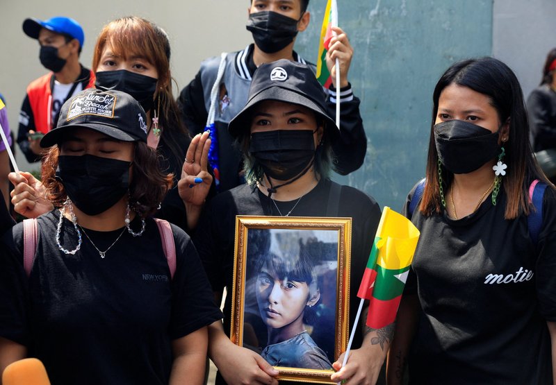 Myanmar citizens who live in Thailand hold a portrait of former state counsellor Aung San Suu Kyi as they protest Myanmar's execution of pro-democracy activists, at the Myanmar Embassy in Bangkok July 26, 2022. (CNS photo/Soe Zeya Tun, Reuters)