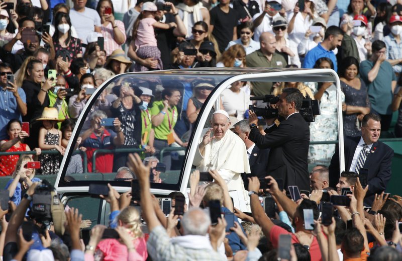 Pope Francis greets the crowd before celebrating Mass at Commonwealth Stadium in Edmonton, Alberta, July 26, 2022. (CNS photo/Paul Haring)