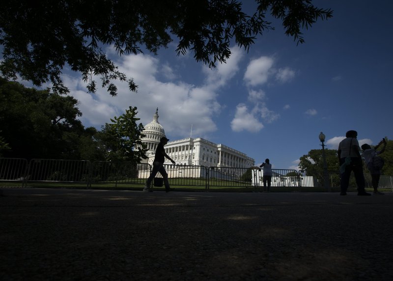 People are seen near the U.S. Capitol in Washington June 24, 2022. In bipartisan vote July 26, U.S. House overwhelmingly passes new legislation to combat human trafficking. (CNS photo/Tyler Orsburn)