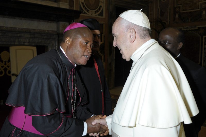 Bishop Peter Ebere Okpaleke of Ekwulobia, Nigeria, greets Pope Francis during a meeting with Nigerian bishops at the Vatican on April 28, 2018. (CNS photo/Vatican Media)