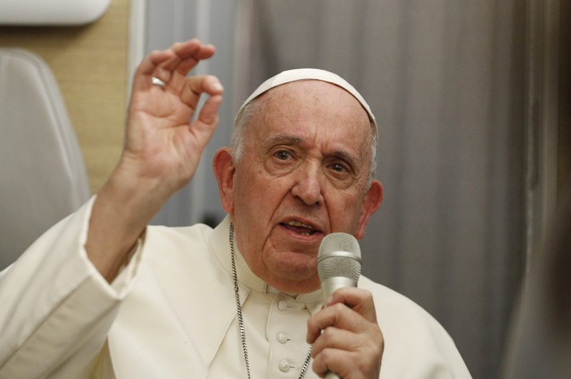 Pope Francis answers questions from journalists aboard his flight from Iqaluit, in the Canadian territory of Nunavut, to Rome July 29, 2022. (CNS photo/Paul Haring