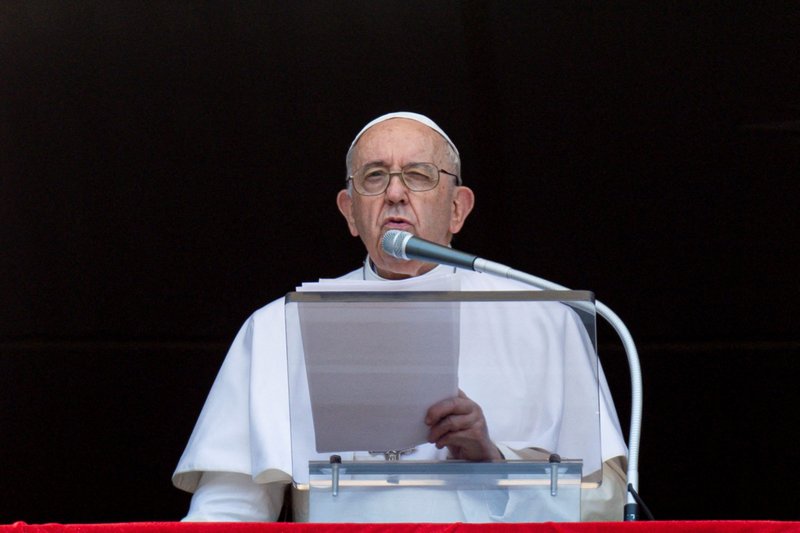 Pope Francis leads the Angelus from the window of his studio overlooking St. Peter's Square at the Vatican Aug. 7, 2022. (CNS photo/Vatican Media via Reuters)