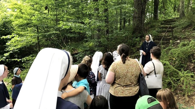 Sister Veronica Sullivan, a Sister of Life, talks about the "McGivney steps" near St. Thomas Cemetery in Thomaston, Conn., in early August 2022. Blessed Michael McGivney, a sainthood candidate, founded the Knights of Columbus in 1882. (CNS photo/Andrew Fowler)
