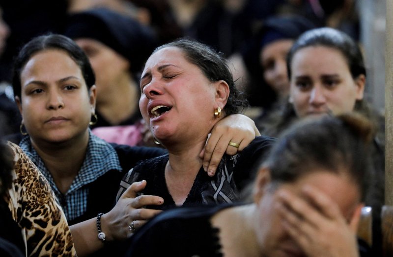 A woman reacts during the funeral of victims who died in the fire that broke out at the Martyr Abu Sefein Orthodox Church. The funeral was at the Church of the Blessed Virgin Mary at Warraq Al Arab district in Giza Governorate, Egypt, Aug. 14, 2022. (CNS photo/Mohamed Abd El Ghany, Reuters)