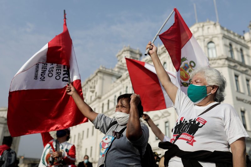 Demonstrators take part in a protest against Peruvian President Pedro Castillo's government, demanding his resignation, in Lima, Peru, in this April 9, 2022, file photo. Amid a political crisis in which the president, his wife and members of her family are accused of corruption and taking bribes, Peru's bishops have called for dialogue and a commitment to uphold democratic institutions. (CNS photo/Angela Ponce, Reuters)