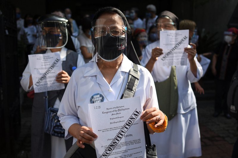 Members of religious groups take part in a protest a few hours before the start of the hearing of oral arguments on the anti-terrorism law, outside a church in Manila, Philippines, in this Feb. 2, 2021, file photo. Critics of the bill said it could be used to stifle political dissent and abuse human rights. (CNS photo/Lisa Marie David, Reuters)