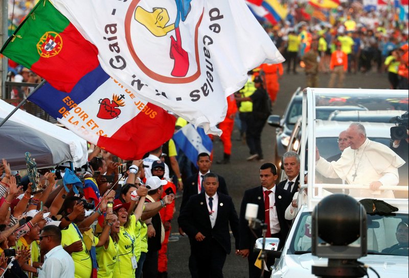 A Portuguese flag is seen near Pope Francis as he greets the crowd before celebrating Mass for World Youth Day pilgrims at St. John Paul II Field in Panama City Jan. 27, 2019. World Youth Day in Lisbon, Portugal, will be during the first week of August 2023, the Vatican announced. (CNS photo/Alessandro Bianchi, Reuters)