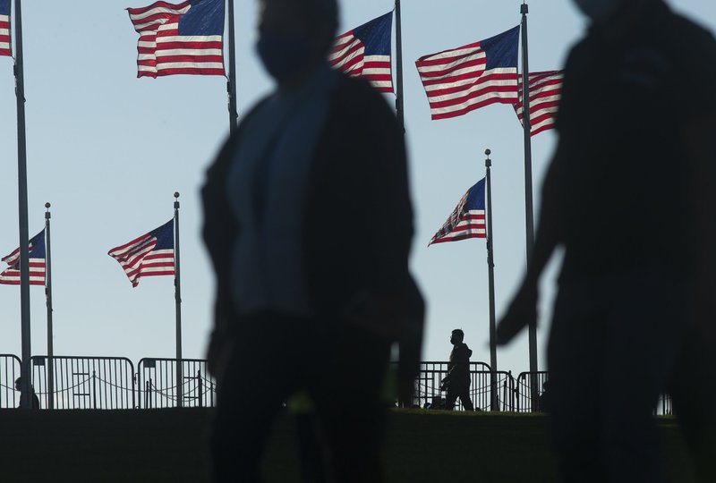 People are seen near the Washington Monument in Washington Nov. 28, 2020. (CNS photo/Tyler Orsburn)