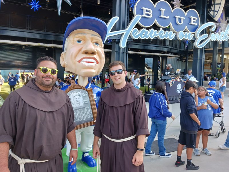 Fathers Tito (left) and Casey (right), at Dodger Stadium. The two Franciscans are on a country-wide tour of all MLB stadiums as part of a modern evangelization project. (Robert Brennan)
