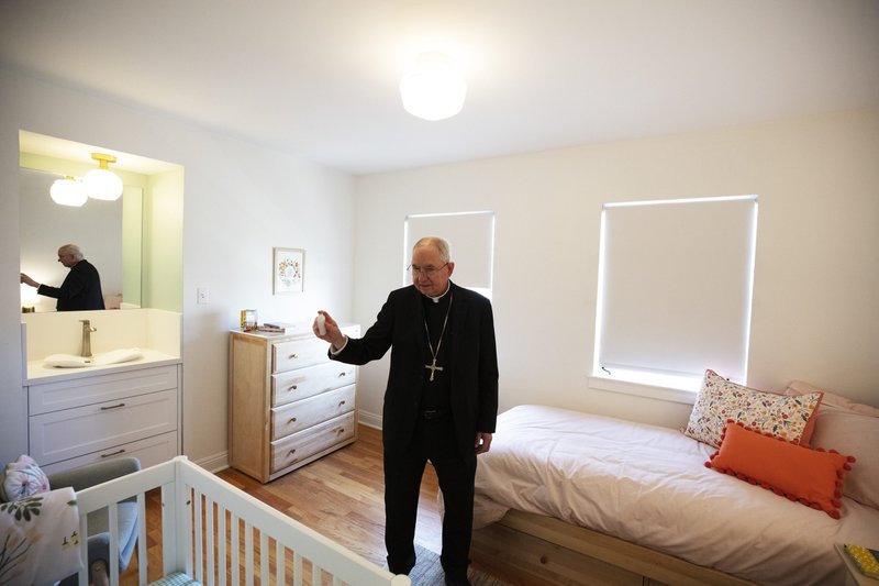Archbishop José H. Gomez blesses Harvest Home's new Pico Home for homeless pregnant women and their children on Aug. 19. (Victor Alemán)