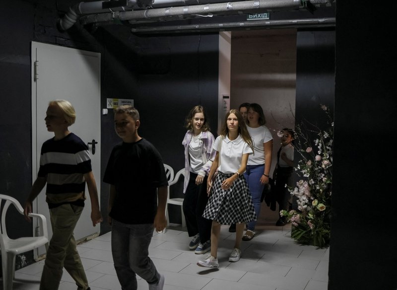 Students visit a shelter for evacuation training on their first day of school in Bucha, Ukraine, Sept. 1, 2022. Ukrainian bishops are welcoming efforts to restart classes for a new school year and offered church basements as emergency air raid shelters for children. (CNS photo/Gleb Garanich, Reuters)