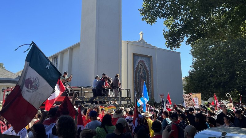 People in Sacramento, Calif., pass Our Lady of Guadalupe Church before marching to the state capitol building Aug. 26, 2022. (CNS photo/Melissa Cedillo)