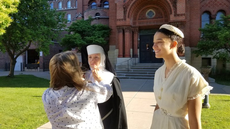Actors receive final touches to their hair and makeup for the documentary "Going Home Like a Shooting Star: Thea Bowman's Journey to Sainthood," in La Crosse, Wis, Oct. 13, 2021. The documentary will air on ABC stations nationwide beginning Oct. 2, 2022. (CNS photo/courtesy NewGroup Media)