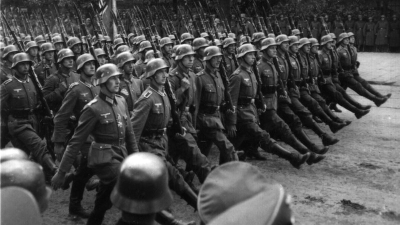 German troops march through Warsaw, Poland, in September 1939. The Polish bishops' conference has cautiously endorsed government demands for $1.29 trillion reparations from Germany for World War II damage. (CNS photo/National Archives)