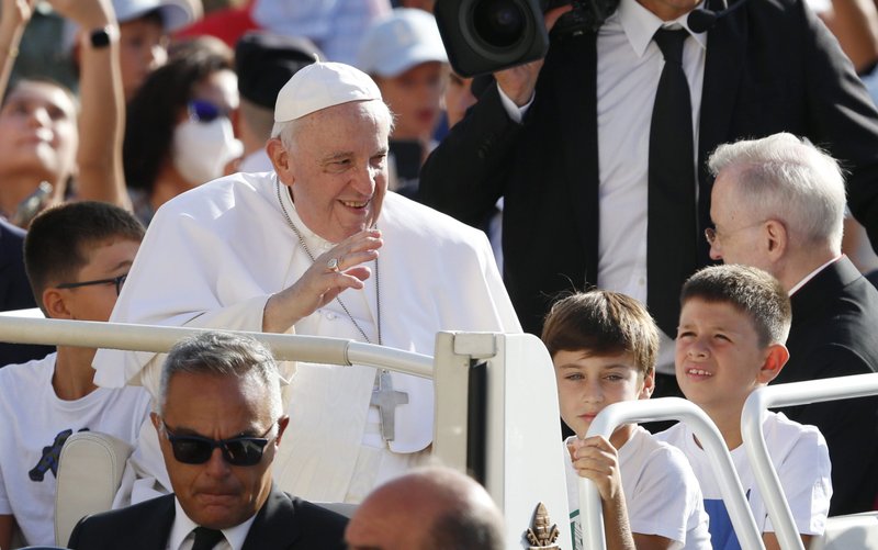 Children ride in the popemobile with Pope Francis as he greets the crowd during his general audience in St. Peter's Square at the Vatican Sept. 7, 2022. (CNS photo/Paul Haring)