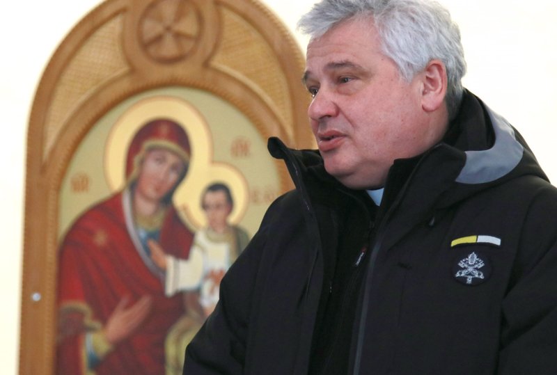 Cardinal Konrad Krajewski, the papal almoner, is pictured near a Marian icon during a visit with Ukrainian refugees in Lviv, Ukraine, in this March 10, 2022, file photo. Cardinal Krajewski plans to visit the cities of Odesa, Zhytomyr and Kharkiv during his fourth visit to Ukraine on behalf of Pope Francis. (CNS photo/courtesy Ukrainian Catholic Church)