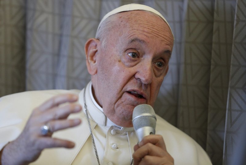 Pope Francis answers questions from journalists aboard his flight from Nur-Sultan, Kazakhstan, to Rome Sept. 15, 2022. (CNS photo/Paul Haring)