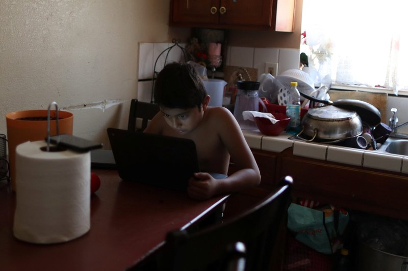 Alexander Ramos, 8, a student in the Los Angeles Unified School District works on a school-issued computer with unreliable internet connectivity Aug. 18, 2020, amid the coronavirus pandemic. (CNS photo/Lucy Nicholson, Reuters)