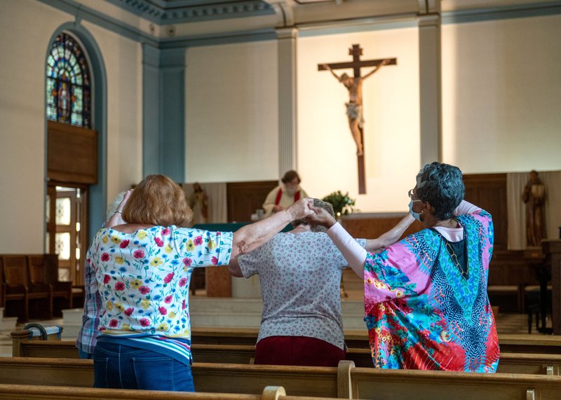 A handful of parishioners in the Gardenville neighborhood of Baltimore attend daily Mass Sept. 16, 2022, at St. Anthony of Padua Catholic Church. (CNS photo/Kevin J. Parks, Catholic Review)