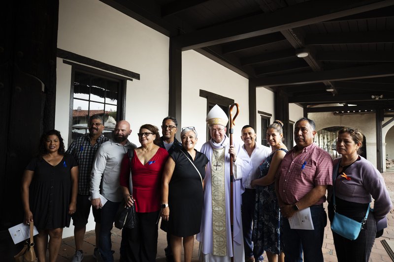 Archbishop Gomez with members of the Mission's staff. (Victor Alemán)