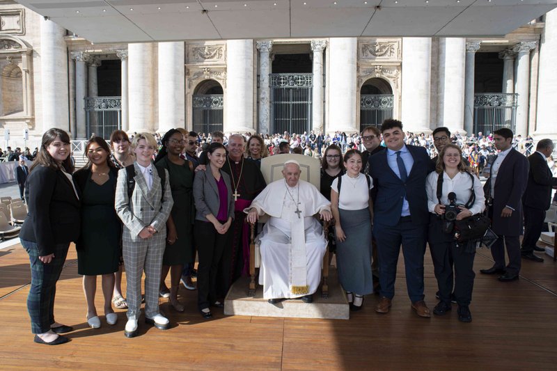 Young students who are members of the National Youth Advisory Council pose with Pope Francis and Archbishop Nelson J. Pérez of Philadelphia, at the pope's right, at the end of his general audience in St. Peter's Square at the Vatican Oct. 13, 2022. The council, launched over the summer, brings the voice of young people into the work and ministry of the National Federation for Catholic Youth Ministry. (CNS photo/Vatican Media)