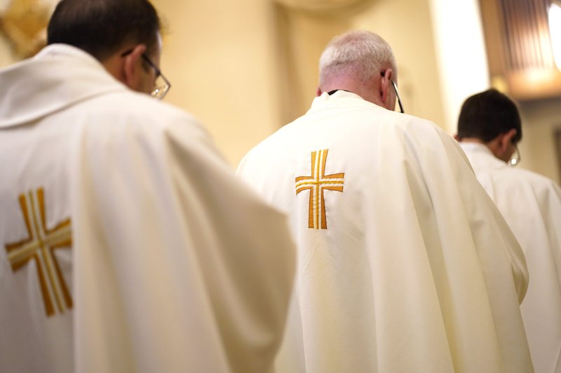 Priests are seen during a special Mass for vocations at Cure of Ars Church in Merrick, N.Y., Aug. 4, 2022, the feast of St. John Vianney, patron of parish priests. (CNS photo/Gregory A. Shemitz)