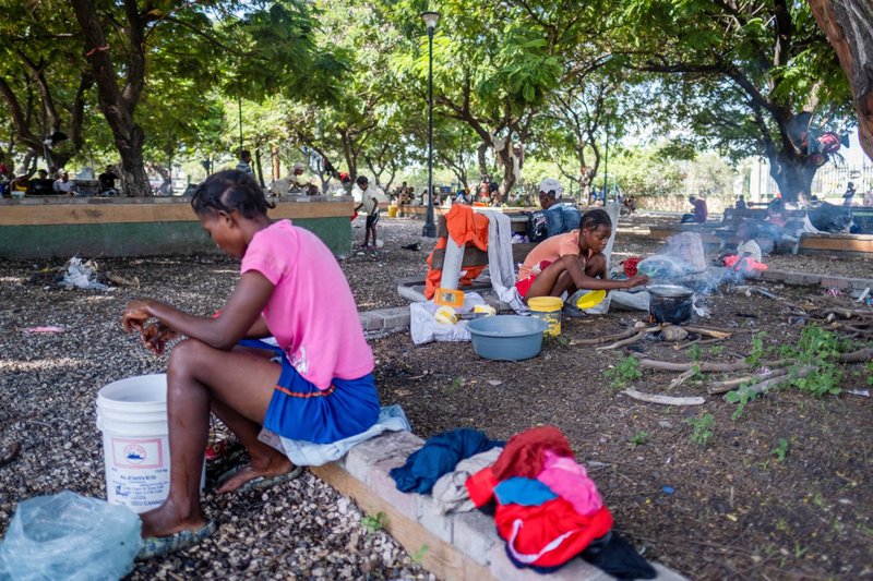 Young Haitian women displaced by gang violence in Cité Soleil take refuge at Hugo Chavez Square in Port-au-Prince Oct. 16, 2022. Haiti is making news for gang violence, but the violence disproportionately affects women, especially with increasing incidences of rape. (CNS photo/Ricardo Arduengo, Reuters)