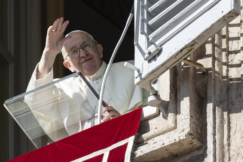 Pope Francis waves to the crowd gathered in St. Peter's Square for the midday recitation of the Angelus Oct. 30, 2022. (CNS photo/Vatican Media)