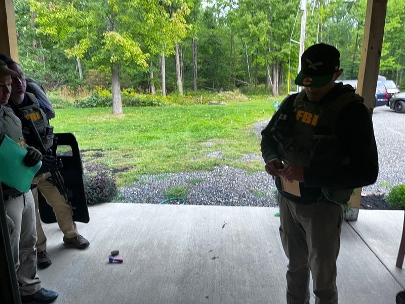 An FBI agent stands outside the Houck residence in Kintnersville, Pennsylvania, on Sept. 23, 2022. Mark Houck was arrested that day and charged with assaulting a Planned Parenthood escort outside an Philadelphia abortion clinic on Oct. 13, 2021. (Courtesy of the Houck family via CNA)