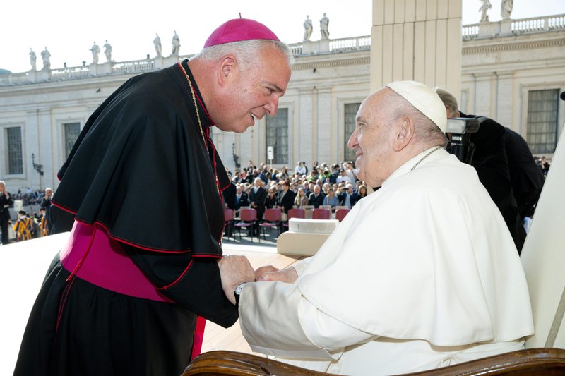 Archbishop Nelson J. Pérez of Philadelphia greets Pope Francis at the end of the pope's weekly general audience in St. Peter's Square Oct. 12, 2022. (CNS photo/Vatican Media)