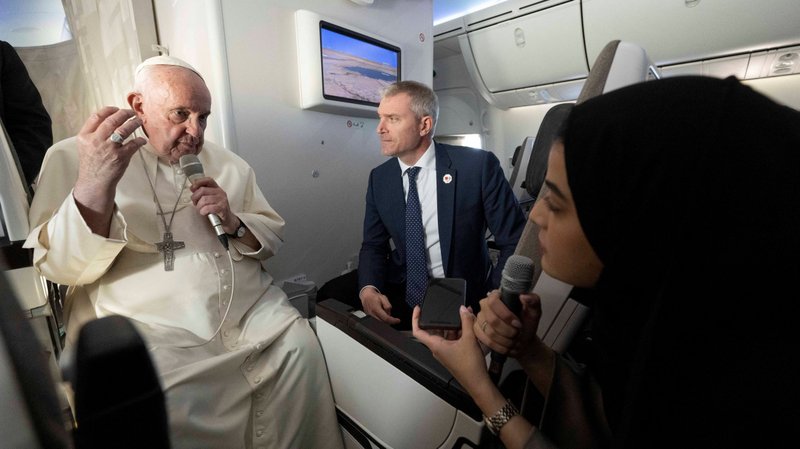Pope Francis speaks with reporters on the flight back to Rome from Bahrain Nov. 6, 2022. (CNS photo/Maurizio Brambatti pool via Reuters)