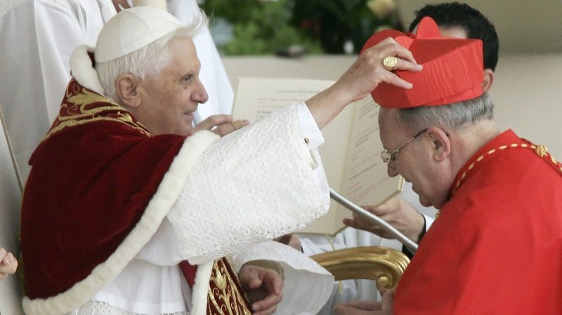French Cardinal Jean-Pierre Ricard of Bordeaux receives his red hat from then-Pope Benedict XVI during his induction into the College of Cardinals at the Vatican March 24, 2006. The cardinal has admitted to abusing a 14-year-old girl 35 years ago. (CNS photo/Tony Gentile, Reuters)