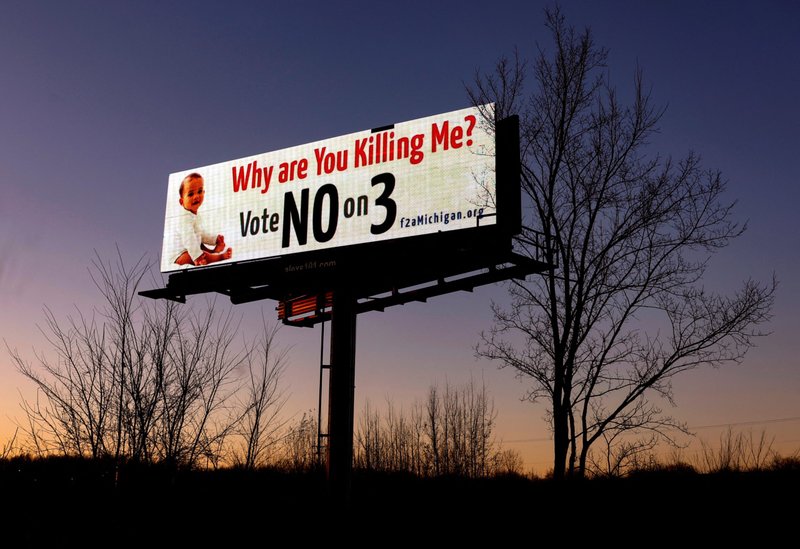 A Michigan billboard against Proposal 3, a ballot measure to codify a right to an abortion, is seen along I-75 outside of Detroit Nov. 6, 2022. Voters approved the measure in the Nov. 8 midterm election. (CNS photo/Evelyn Hockstein, Reuters)