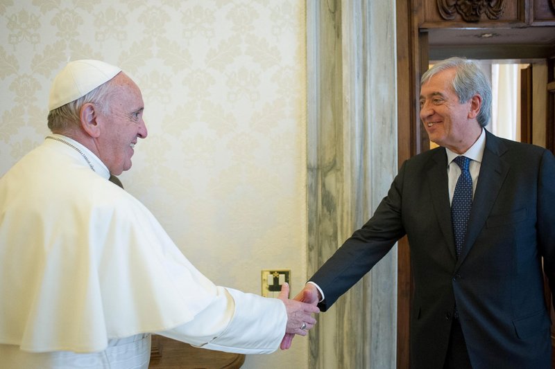 Pope Francis greets Libero Milone, then the Vatican's auditor general, at the Vatican April 1, 2016. Milone and his deputy are seeking damages from the Vatican, claiming they were forced to resign after discovering irregularities and corruption. (CNS photo/L'Osservatore Romano via Reuters)
