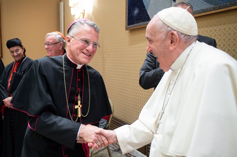 Pope Francis greets Archbishop Timothy P. Broglio, president of the U.S. Conference of Catholic Bishops, during a meeting with the presidents and coordinators of the regional assemblies of the Synod of Bishops at the Vatican Nov. 28, 2022. (CNS photo/Vatican Media)