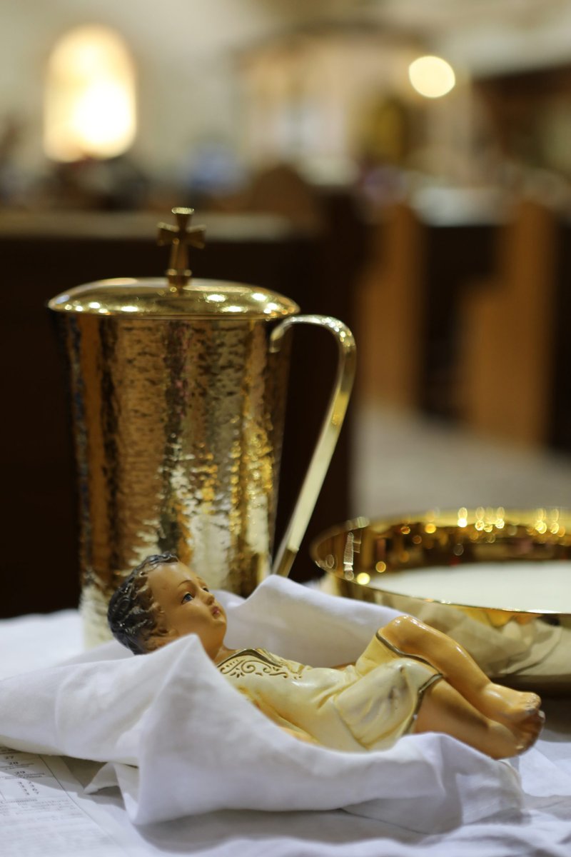 A figurine of the Christ Child is seen before Communion during Christmas Mass at San Jose Church in Austin, Texas. (CNS/Bob Roller)
