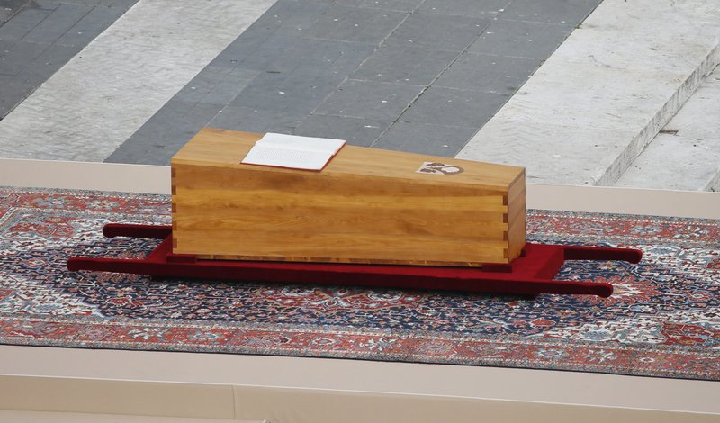 The Book of the Gospels rests on the casket of Pope Benedict XVI during his funeral Mass in St. Peter's Square at the Vatican Jan. 5, 2023. The night before the funeral, when his body was placed in the casket, the Vatican also placed in it a metal tube containing a 1,000-word text, known as a "rogito," summarizing his life and ministry. (CNS photo/Paul Haring)