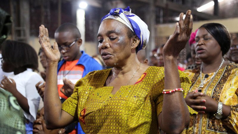A woman prays during morning Mass at St. Charles Church in Kinshasa, Congo, Jan. 22, 2023. The Center for Applied Research in the Apostolate (CARA) gathers results of a poll conducted by the World Values Survey and reports findings on Mass attendance worldwide, noting that pre-and-post-pandemic factors and economic correlations affect those numbers. (OSV News photo/Justin Makangara, Reuters)