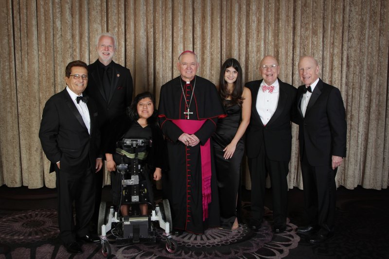 From left: Dr. Nabil El Sayad, Deacon Kevin McCardle, Josie Hull, Archbishop José H. Gomez, Siena Dancsecs,  Mike Smith, and Tim Smith. (Belle N' Beau Photography)