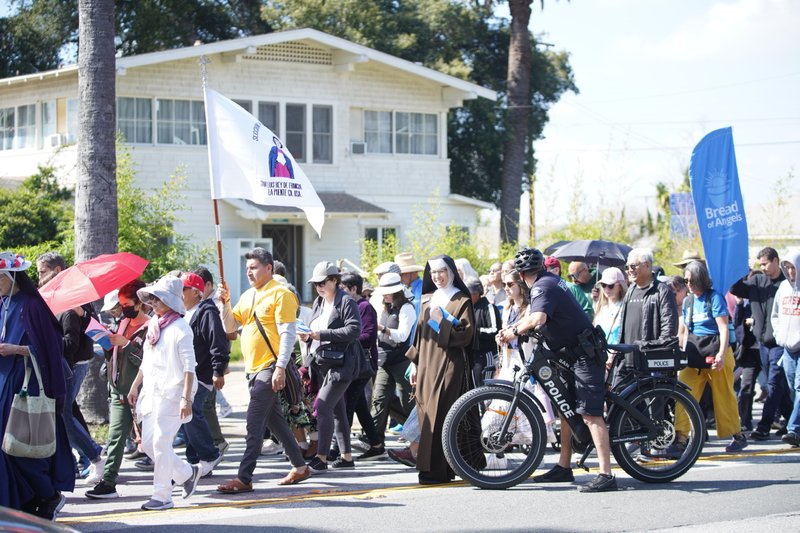 Hundreds of parishioners walk with Los Angeles Archbishop José H. Gomez and the Blessed Sacrament during the 6-mile eucharistic procession that went from Mission San Gabriel Arcángel to St. Luke the Evangelist Church in Temple City, then back to the mission. (Archdiocese of Los Angeles/Digital Team)