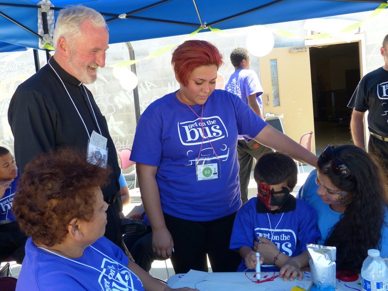 Bishop O’Connell visits with family members of incarcerated inmates during a “Get On The Bus” event at Folsom Prison in 2016 organized by the Center For Restorative Justice Works. (R.W. Dellinger)