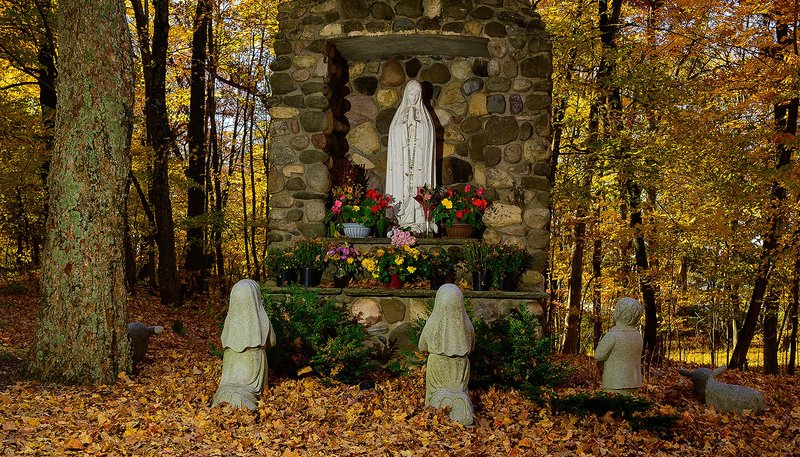 Fall colors surround a grotto to Our Lady of Fátima on the grounds of the Basilica and National Shrine of Mary at Holy Hill in Hubertus, Wisconsin, Oct. 16, 2020. (CNS/Sam Lucero, The Compass)