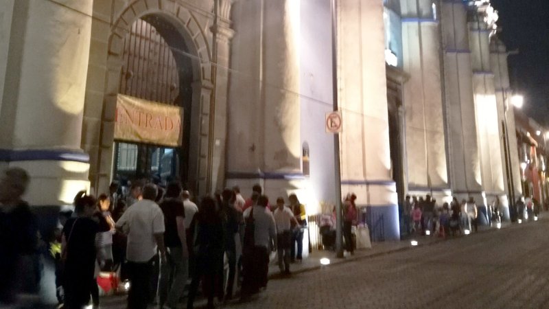 A line of people waiting to enter a church in Puebla, Mexico, on Holy Thursday in 2018. (Courtesy Amy Welborn)