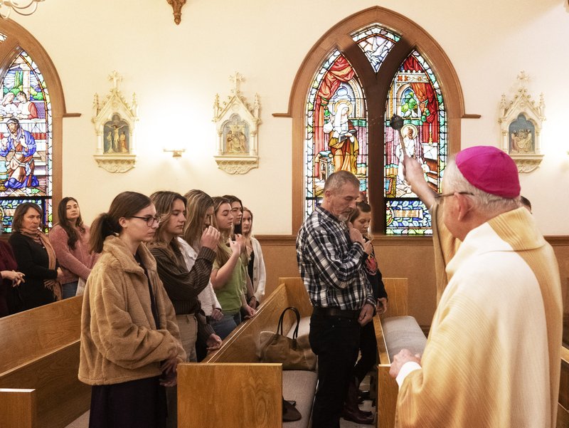 Archbishop José H. Gomez sprinkles holy water over the congregation celebrating Mass at St. Anthony Croatian Church on April 16. The bilingual Mass in English and Croatian was also part of Mladifest, which hosted Croatian Catholic youth from all over North America. (Victor Alemán)
