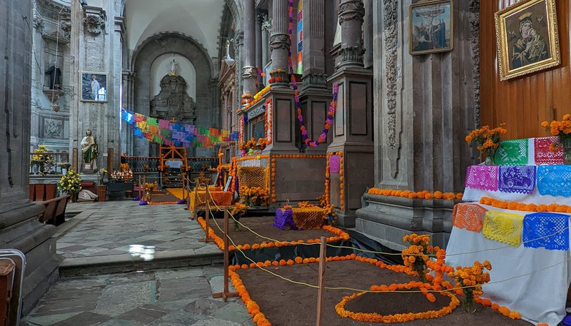 Side altars in the Cathedral of Guanajuato ahead of Dia de los Muertos during the author’s visit last year. Each year, Mexican families gather before All Saints' Day, Nov. 1, to decorate their altars with photographs, food, candles, and flowers. (Amy Welborn)