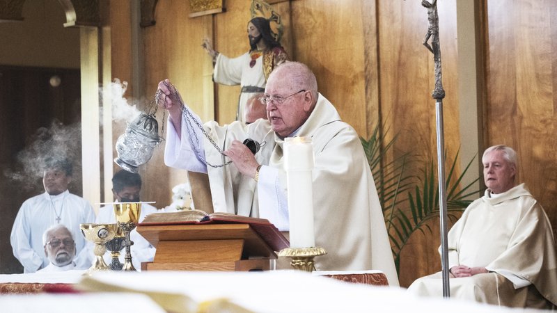 Msgr. John Moretta, pastor of Resurrection Church in Boyle Heights, uses incense during a special Mass on April 30 celebrating 55 years since his ordination to the priesthood and 40 years at Resurrection. (Victor Alemán)