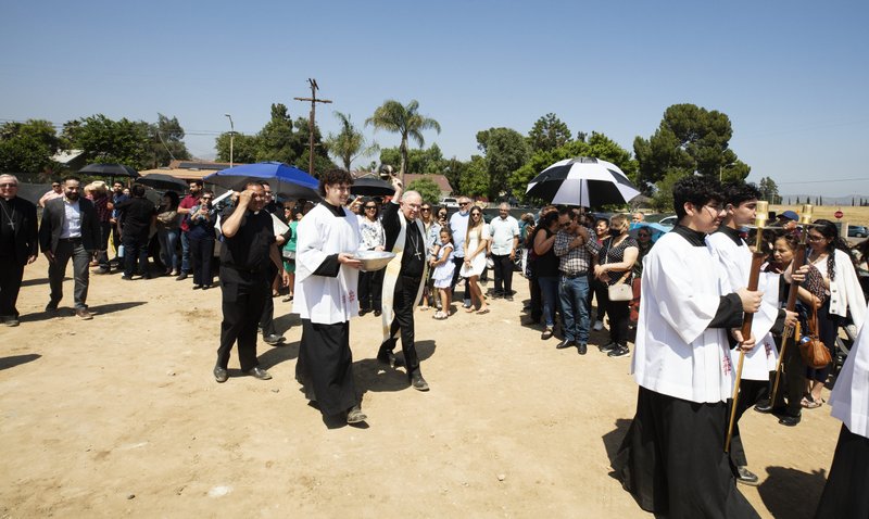 Archbishop José H. Gomez blesses the crowd at the groundbreaking for the new Guardian Angel Church building in Pacoima. (Victor Alemán)
