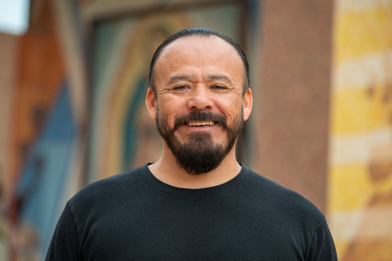 Father Filiberto Cortez, associate pastor at St. Columbkille and Nativity Churches in South LA, is among a group of LA priests that have been welcoming migrants bused from Texas this summer. (John Rueda)